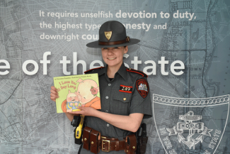 Trooper Applin reading "I Love You All Day Long"