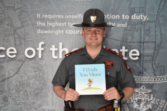Trooper Cedrone reading "I Wish You More"