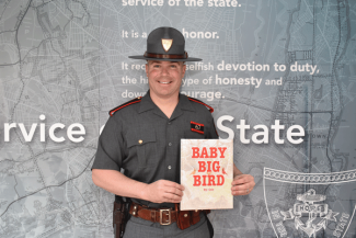 Detective Kyle Shibley reading "Baby Big Bird"