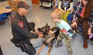 State police dog with child