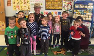 state trooper reading to a class