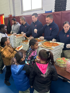 kids being served food by officers